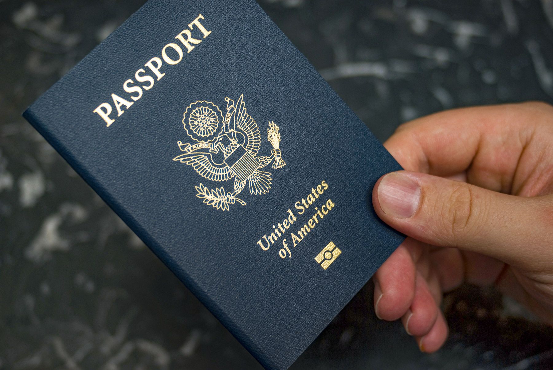 man-holding-U.S.-passport